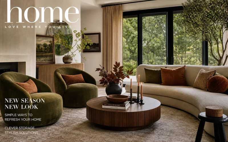 Stylish living room showcasing must-have home decor trends with earthy tones, curved furniture, and layered textures