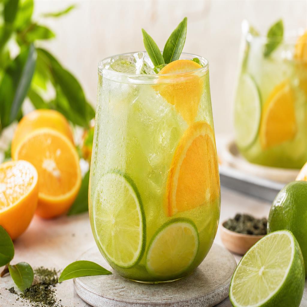 Green tea citrus cooler with lime and orange slices