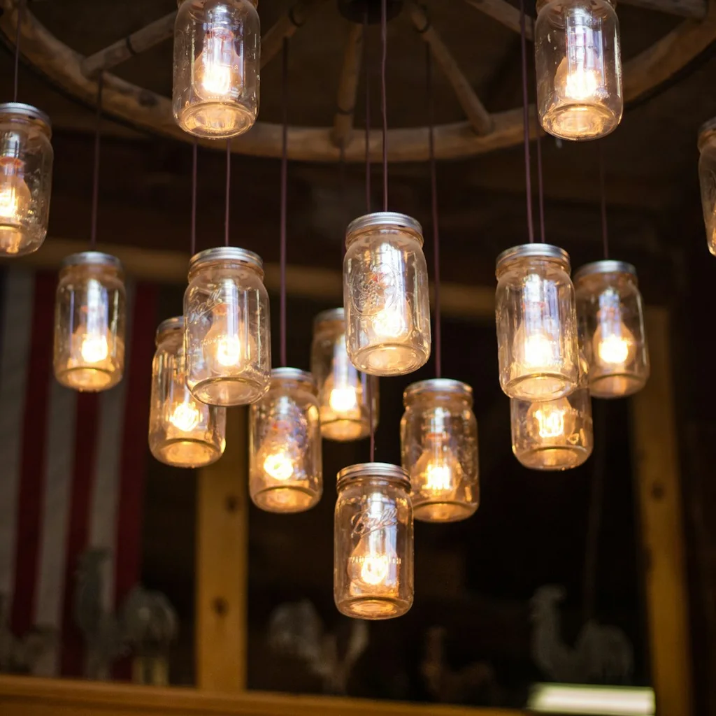 Hanging mason jar lantern with glowing bulb for patio lighting